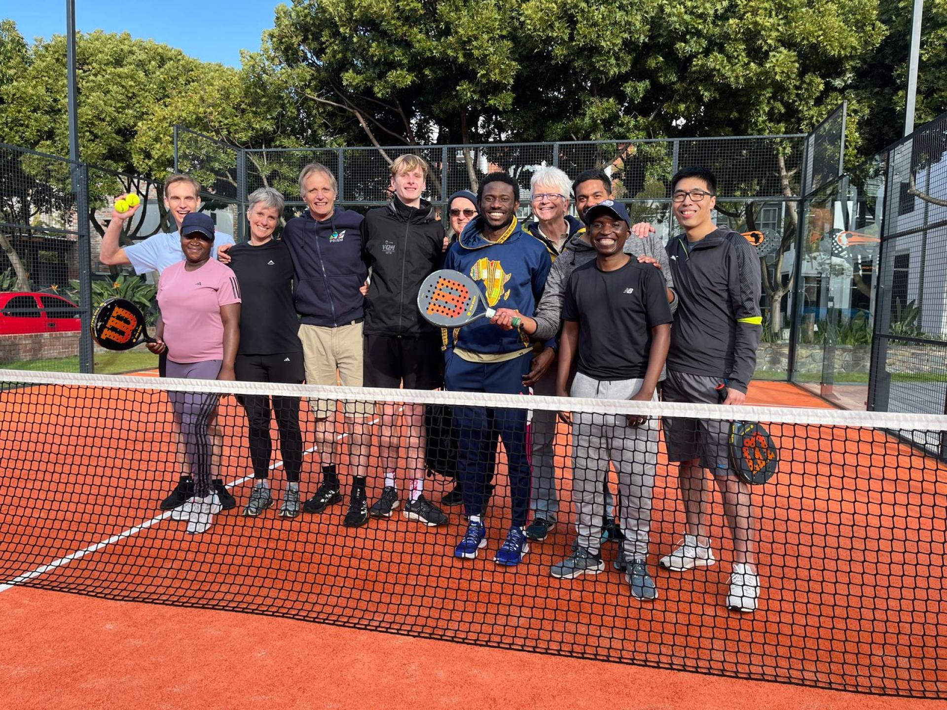 PRISM members, and family play padel