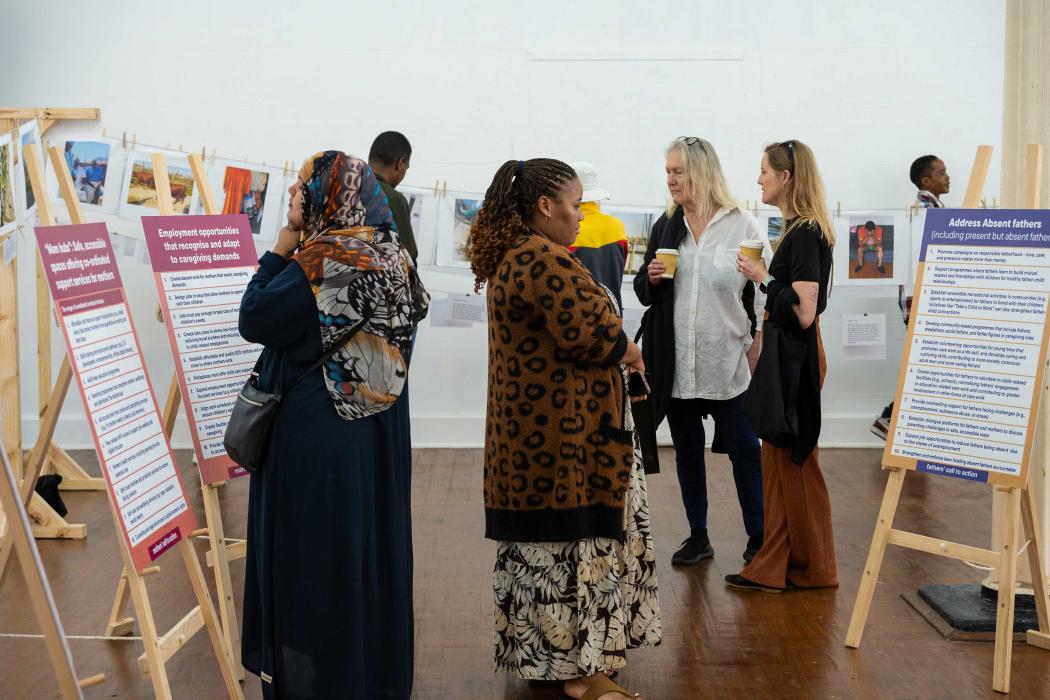 Visitors move through the exhibition, reflecting on the mothers’ Calls to Action.