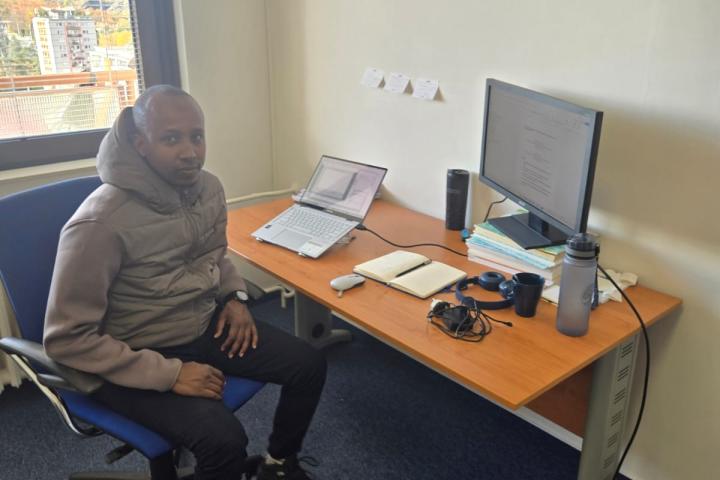 Abdiaziz at Charles University in his office