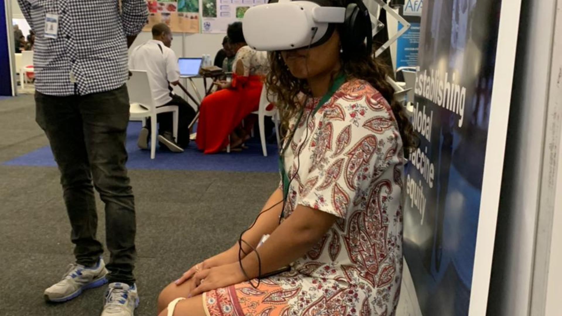 Nadine Veldsman participating in a virtual reality experience at the World Science Forum 2022