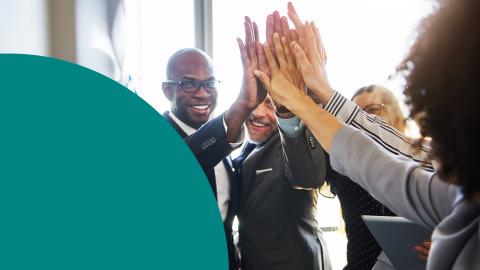 Team of people high-fiving