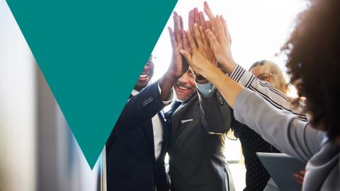 Team of people high-fiving