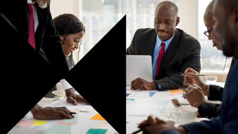 Meeting of team of executives at office table
