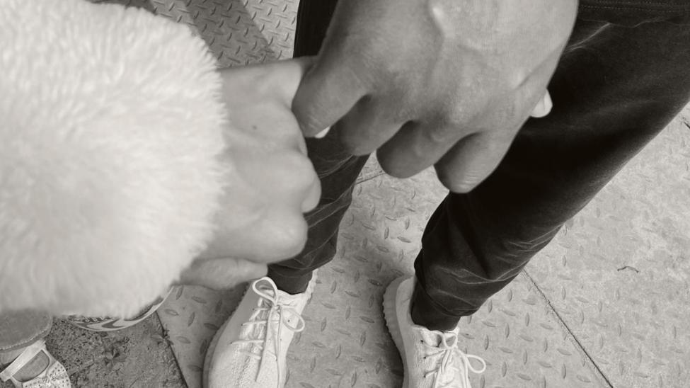 Parents holding hands