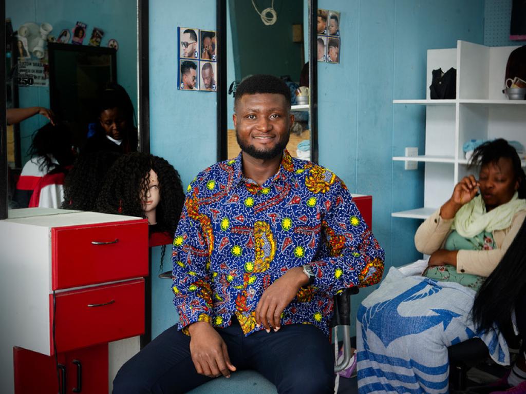 Ghanaian master’s student Bright Tetteh is co-founder of Learn a Skill, which teaches young, unemployed women in his country income-generating skills such as hairdressing, sewing and beadmaking. (Photos taken at a hair salon in Cape Town.)