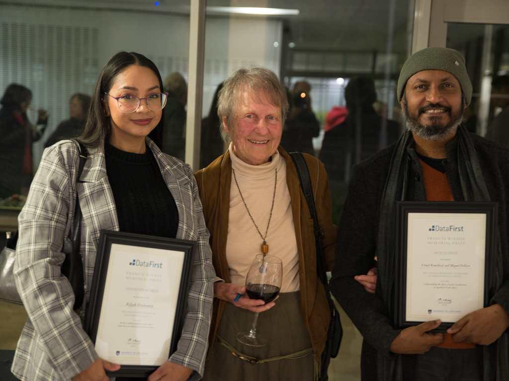 The late Emer Prof Francis Wilson’s widow, Lindy Wilson (middle), congratulates the winners of the Francis Wilson Memorial Prize for Data-Driven Research Dr Rifqah Roomaney of the University of the Western Cape (left) and UCT’s Prof Vimal Ranchhod of SALDRU. Photo Prof Martin Wittenberg.