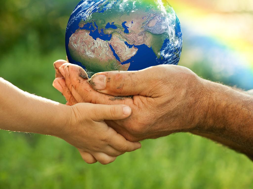 Two hands holding the earth
