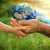 Two hands holding the earth